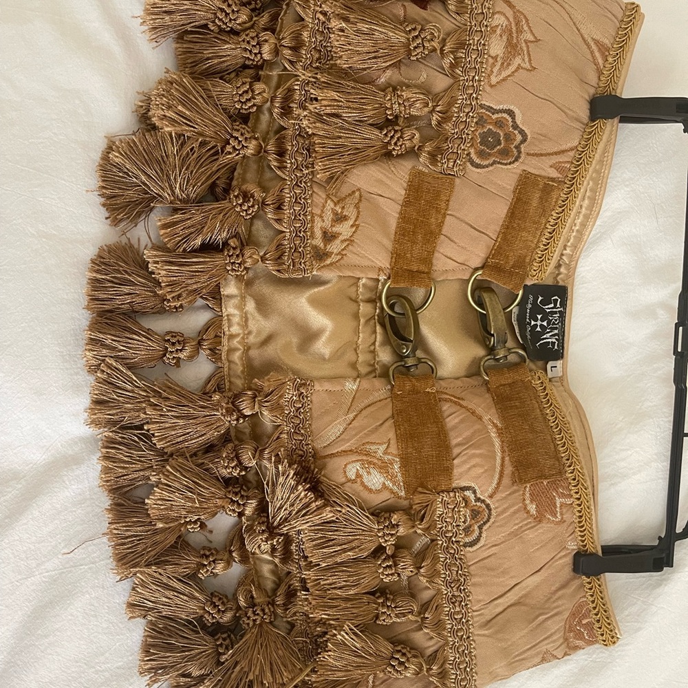 Gold mini steampunk tassel skirt. Made for show with heavy duty buckles.